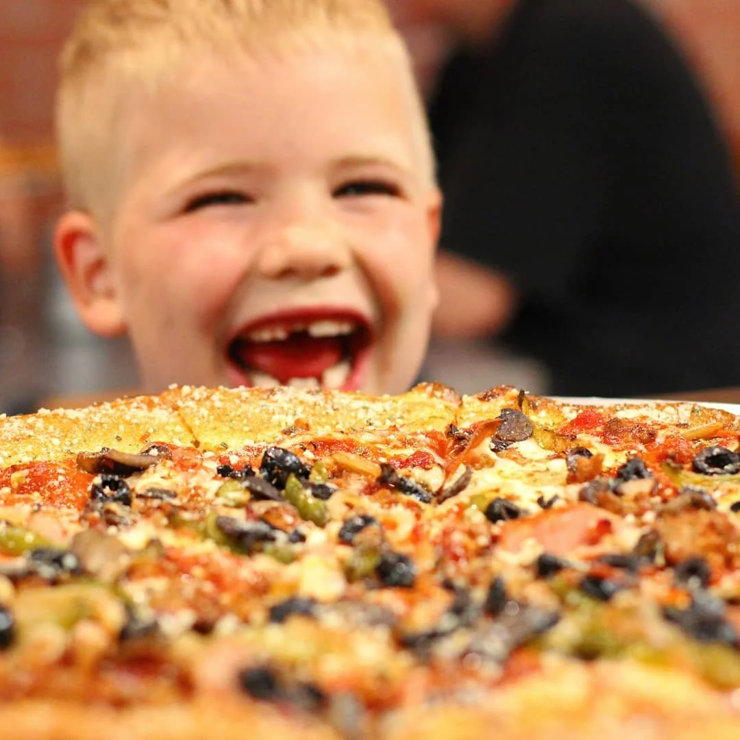A playful bear-shaped pizza creation
