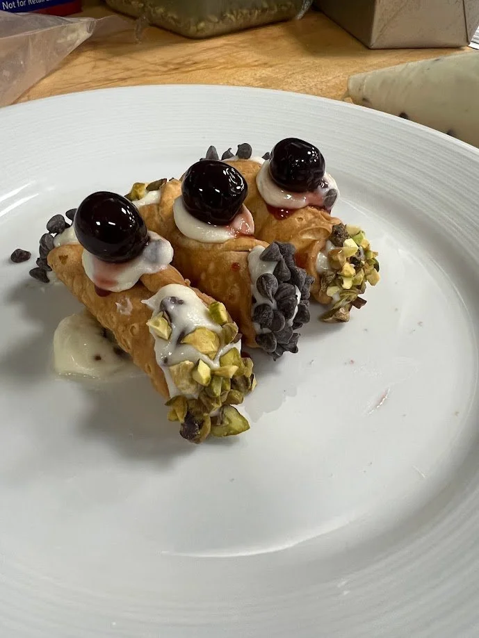 Traditional Italian cannoli dusted with sugar